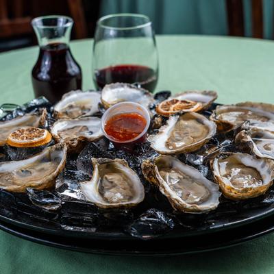 Fresh raw oysters, side view.