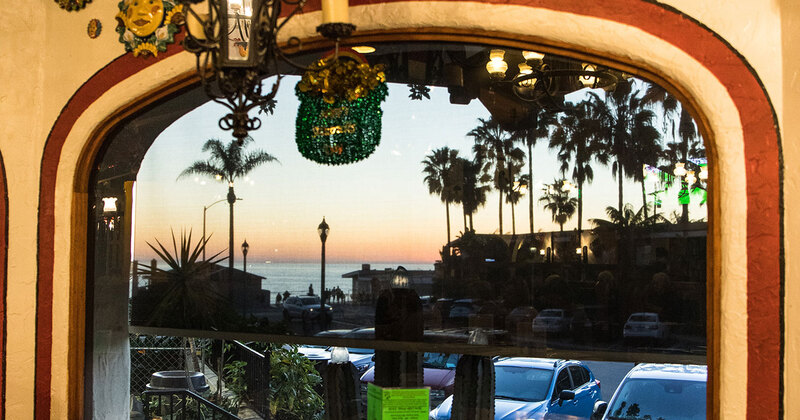 View from the window towards the sea and the sunset