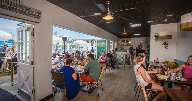 Guests enjoying food and drinks inside