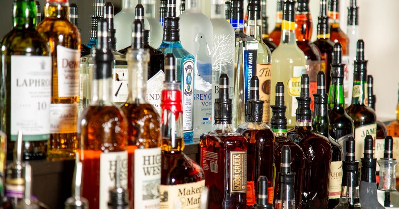A well-stocked bar with various bottles of liquor