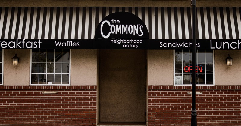 Exterior, front view to restaurant, entrance, sign above