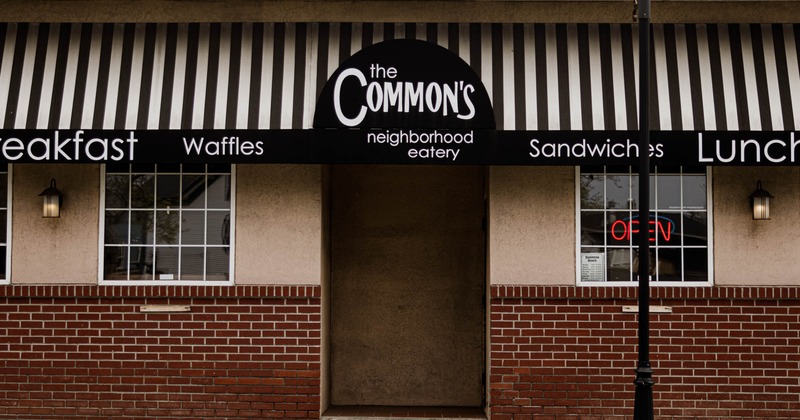 Exterior, front view to restaurant, entrance, sign above