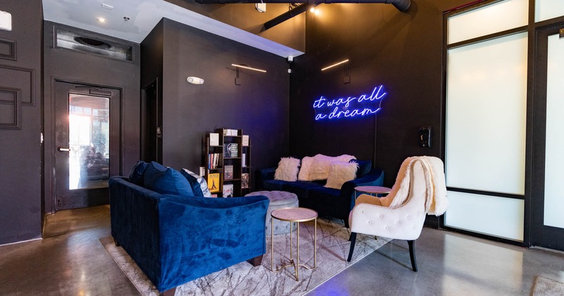 Interior, seating area with a table, armchair and sofas