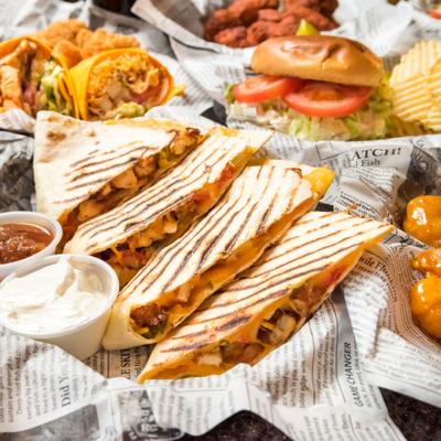 Chicken quesadillas with dressing.