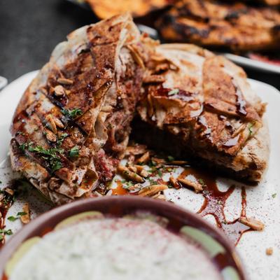 Palestinian chicken flatbread, close-up.