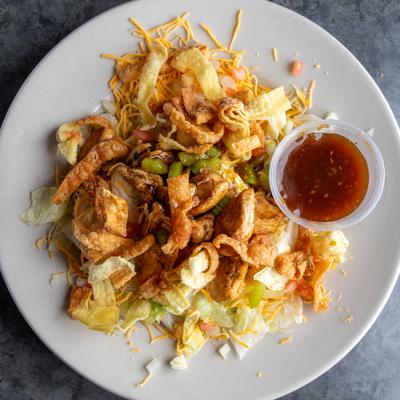 Oriental Chicken Salad served with a cup of dressing.