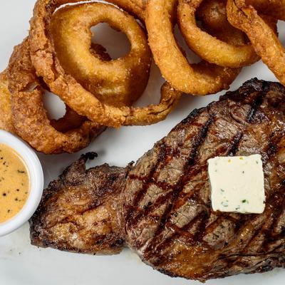 Grilled steak and onion rings.