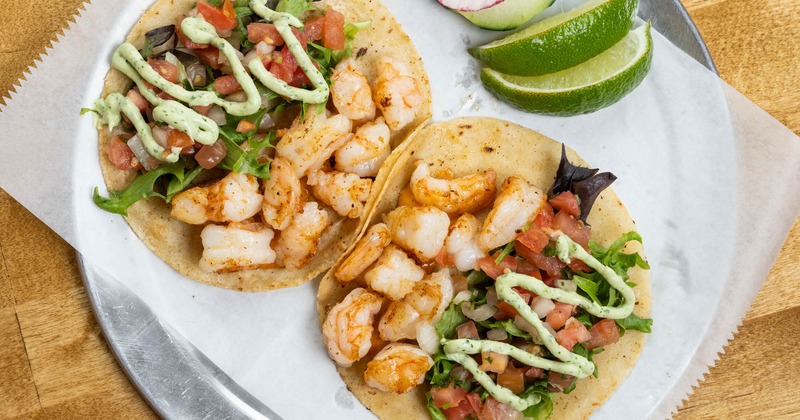 Shrimp tacos with homemade chipotle mayo, spring mix, pico de gallo, avocado cream