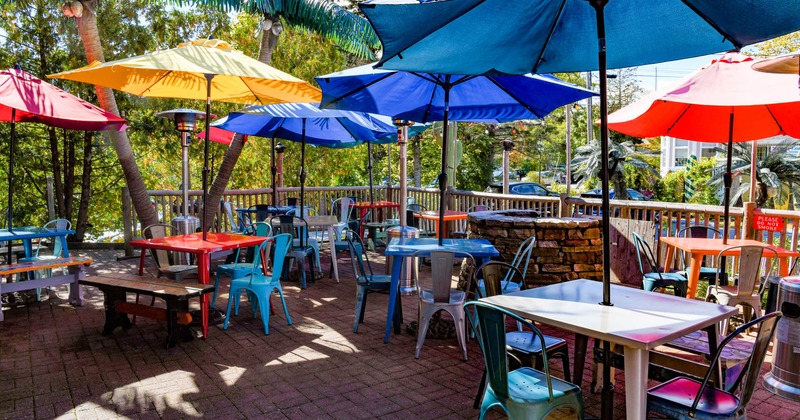 Outside, seating area with tables and parasols