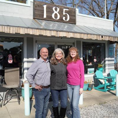 The owners’ family posing in front of the restaurant.