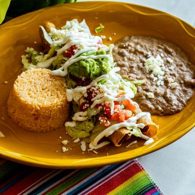 Flauta with a side of beans and rice.