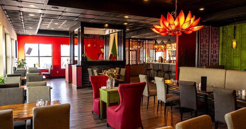 Interior, colorful upholstered seating, decoration, large red orange lotus chandelier