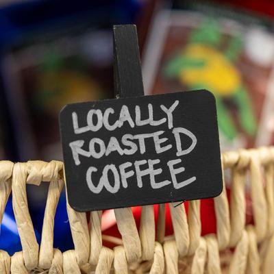 Label on a basket reading locally roasted coffee.