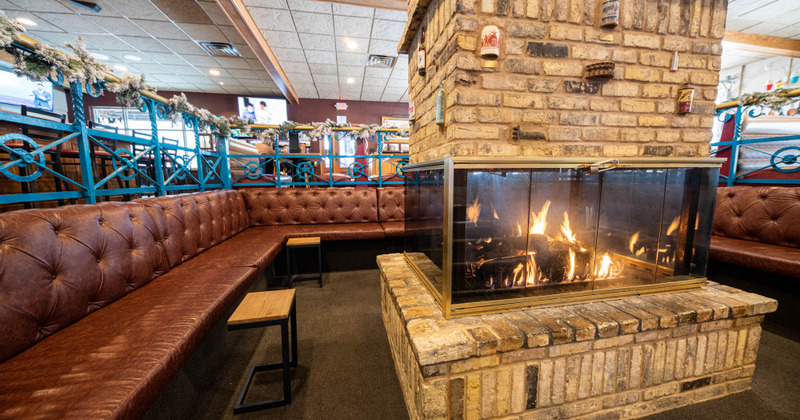 Interior, the fireplace in the middle of the seating area