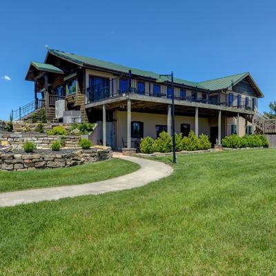 The Country Cabin outside, restaurant building surrounded by a vast lawn.