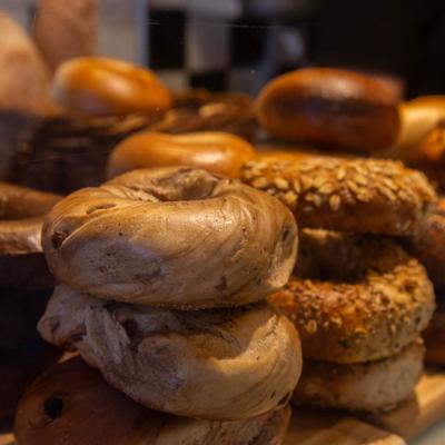 Stacked assorted bagels.