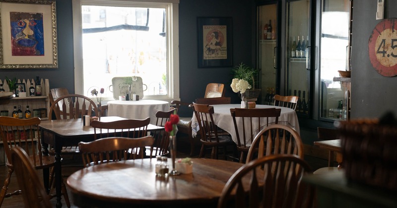 Cozy cafe interior with wooden tables and chairs
