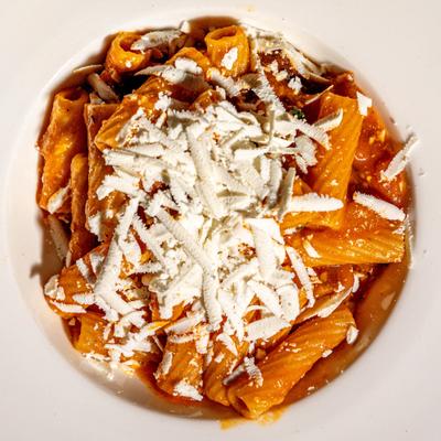 Rigatoni pasta, eggplant, and fresh dried ricotta in light tomato sauce.