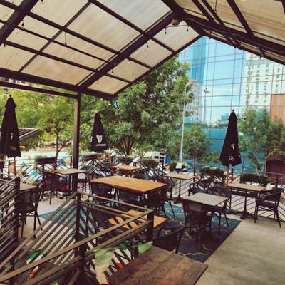 Terrace, table and seats with parasols