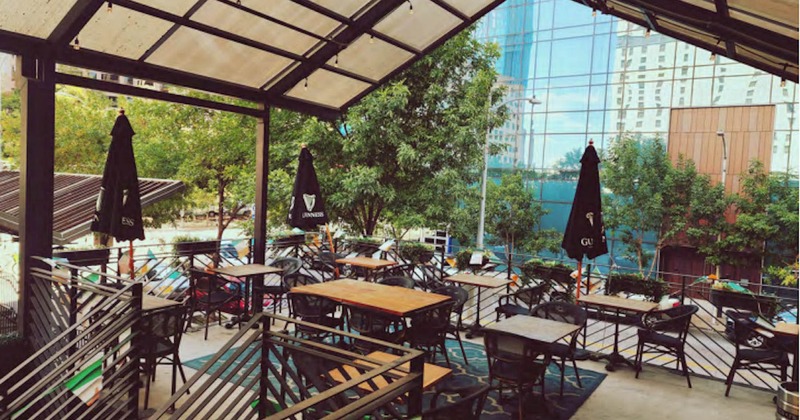 Terrace, table and seats with parasols