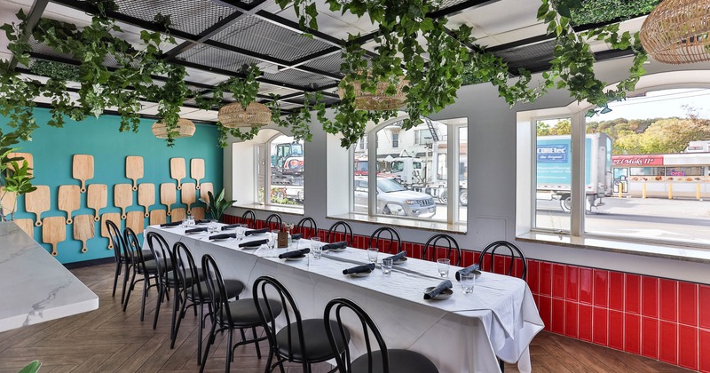 Interior, long table ready for guests