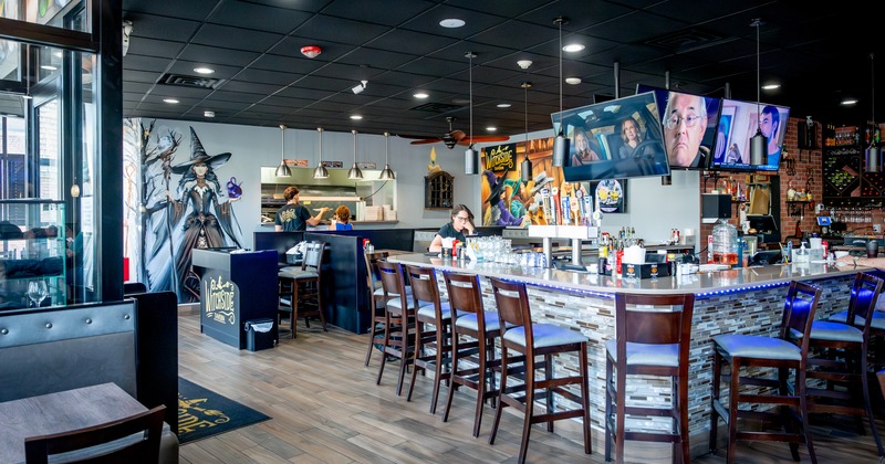 Bar, stools, tv screen above