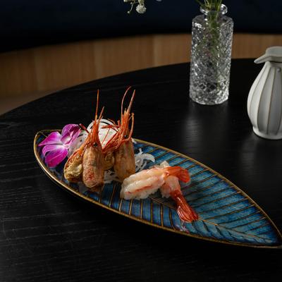 Shrimp sushi plate on a table.