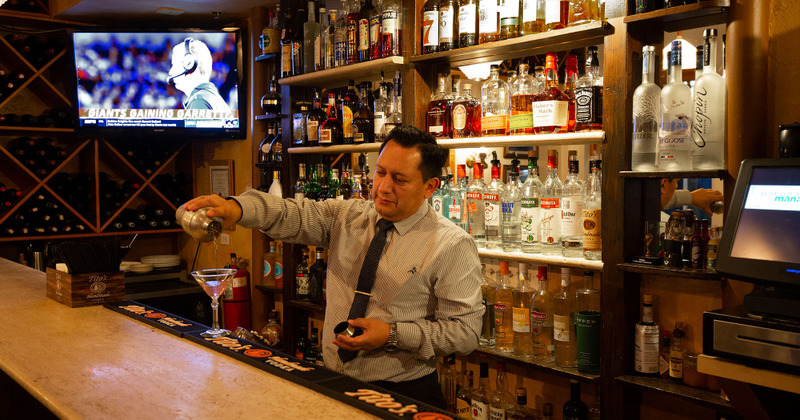 Bar Area - bartender pouring drink