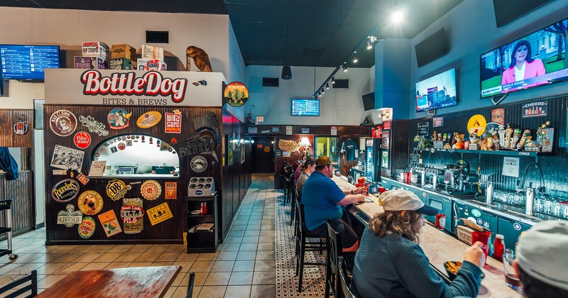 Interior, bar and bar stools, guests sitting at the bar