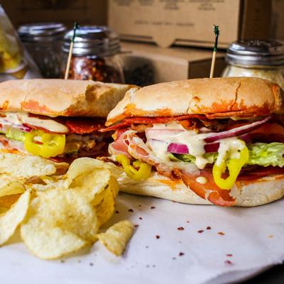 Italian sub sandwich with chips on the side