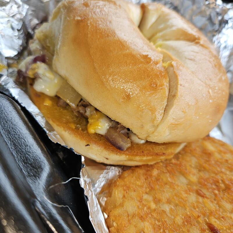 Steak Egg & Cheese Bagel and Hashbrown photo