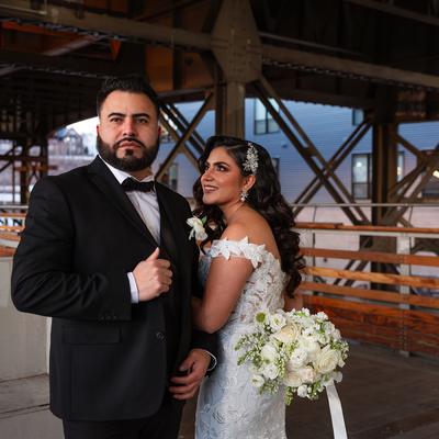 A newlywed couple posing for a picture