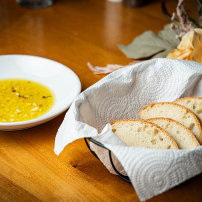 Bread & Garlic Oil Side served on a wooden table.