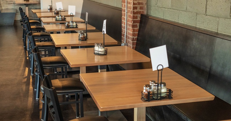 Restaurant interior, dining area, tables and chairs lined up