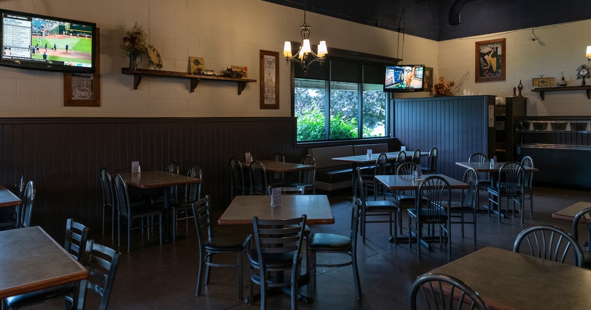Interior, dining area, tables and chairs, TV on the wall
