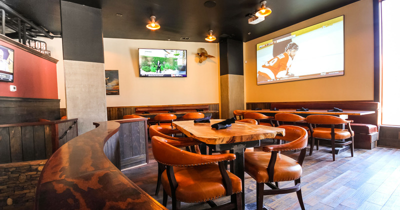 Tables set, big TVs on the wall