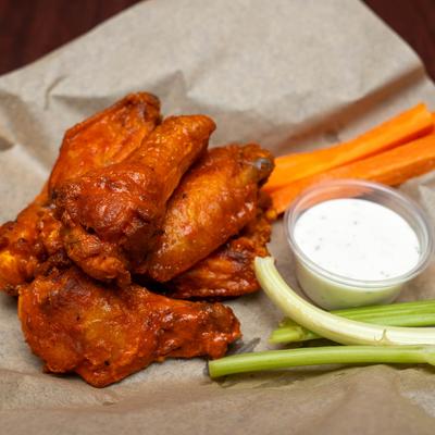 Buffalo chicken wings, with carrots, celery, and dip.