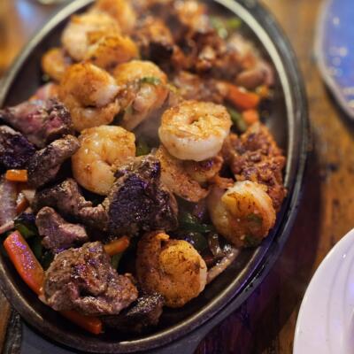 Fajitas 4-2 (for two) - Surf & Turf shown in photo at 13 Tacos & Taps.