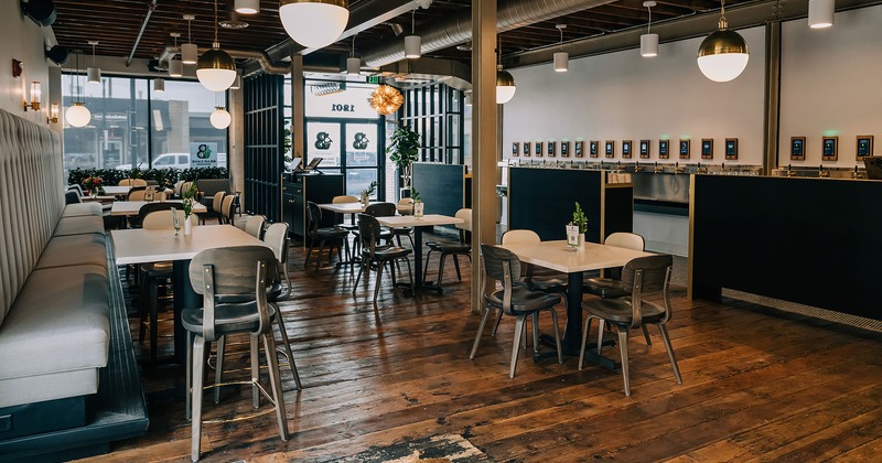 Interior, seating, tables and an area with craft beer taps