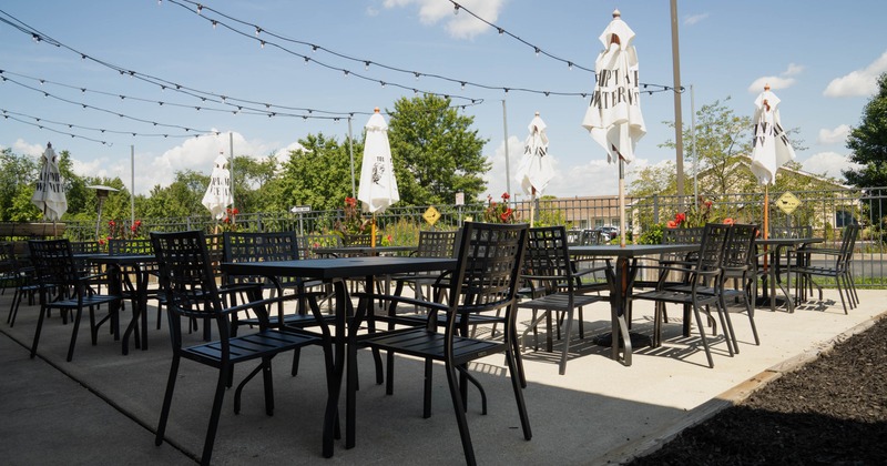 Exterior seating area with tables and chairs