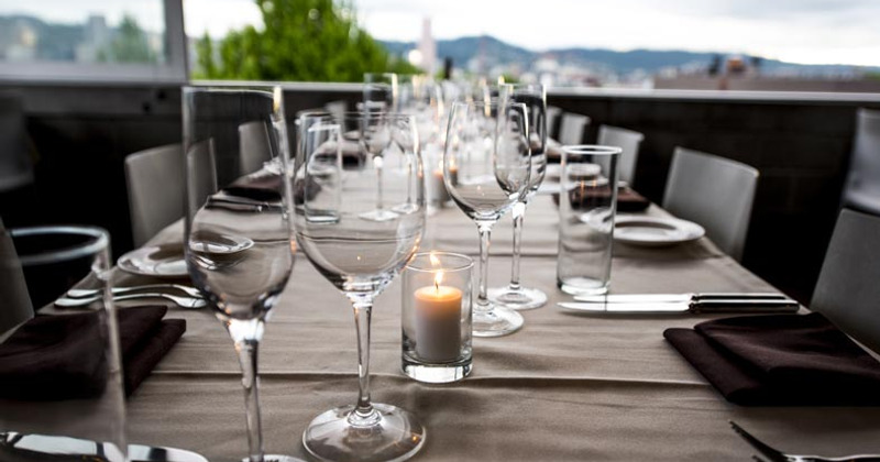 Glasses and cutlery on table, close-up