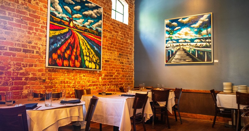 Set tables for dining, painting artwork on walls