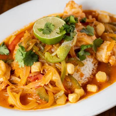 Sauteed seafood and veggies in fresh tomato sauce, on a bed of Jasmine rice.