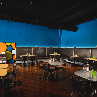 Interior, tables with booth seating sofa.