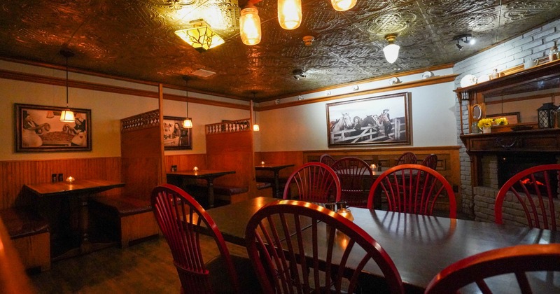 Interior, dining area, tables for four and six, seating booths with tables in the back