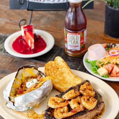 Various menu items served on the table with bottle of Iced Tea.