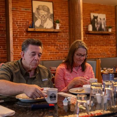 Guests dining at a table.