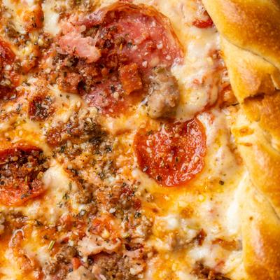 Detail of a peperoni pizza, top view.