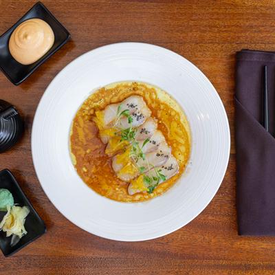 Halibut sashimi, with yuzu jam, black sea salt, cilantro, and yuzu ponzu.