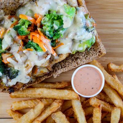 California chicken sub, fries and a sauce dip.
